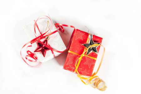 Christmas gift boxes and decorations on white background, top view copy space isolation