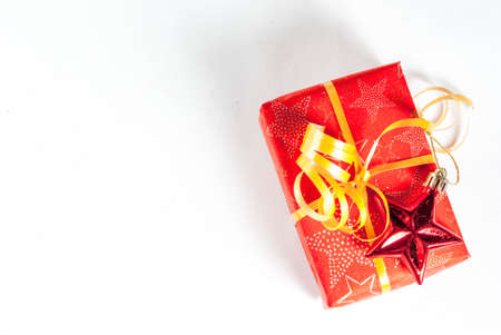 Christmas gift box and decorations on white background, top view copy space isolationの写真素材