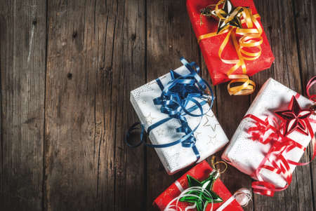 Christmas gift boxes, old rustic wooden background, copy space top view