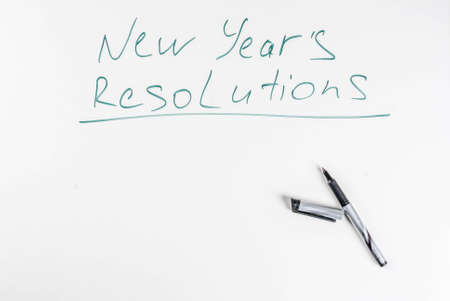 New years resolutions, white board background with pen, copy spaceの写真素材