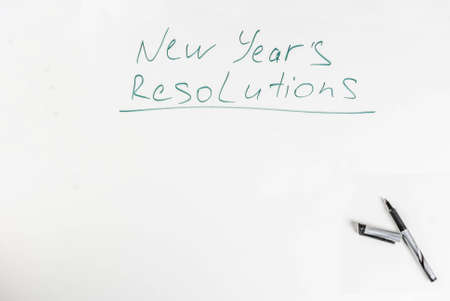 New years resolutions, white board background with pen, copy spaceの写真素材