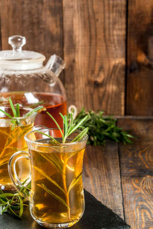 Rosemary tea on  wooden background. Copy spaceの写真素材