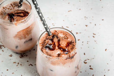 Summer refreshment drinks. Chilled iced chocolate cocoa. With scoop of chocolate ice cream,...