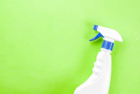 Spring cleaning concept Cleaning spray on green background copy spaceの写真素材