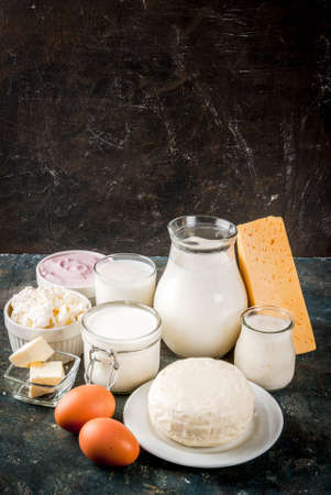 Healthy food concept. Set of dairy products dark blue background copy spaceの写真素材
