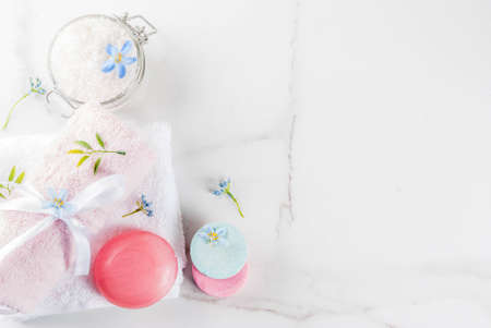 Spa relax and bath concept, sea salt, soap, with cosmetics and towels in bathroom white background, copy spaceの写真素材