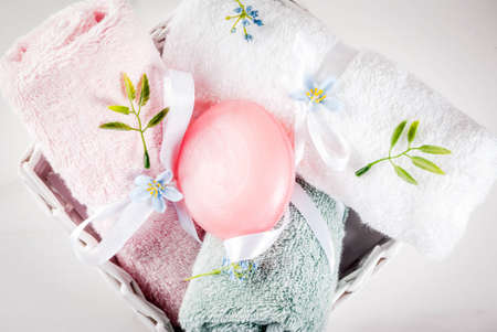 Spa relax and bath concept, sea salt, soap, with cosmetics and towels in bathroom white background, copy spaceの写真素材