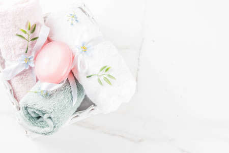 Spa relax and bath concept, sea salt, soap, with cosmetics and towels in bathroom white background, copy spaceの写真素材