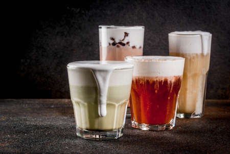 Trendy food and drinks, assortment 4 kinds of Cheese Tea with whipped cream cheese, on dark backgroundの写真素材