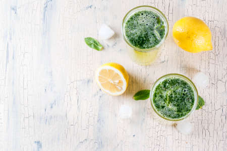 Indian traditional drink, Mint Masala Soda cocktail with lemon, mint and spices, light concrete background, copy space top viewの写真素材