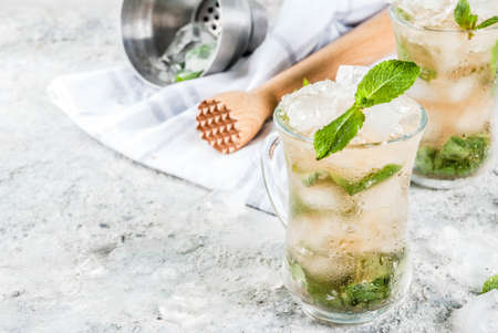 Cold summer beverage, mint julep cocktail drink, grey stone background copy spaceの写真素材