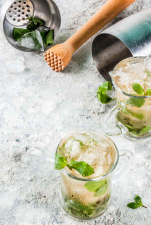 Cold summer beverage, mint julep cocktail drink, grey stone background copy spaceの写真素材