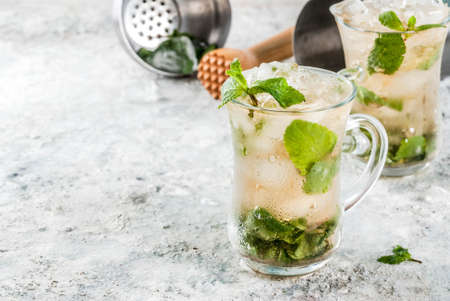 Cold summer beverage, mint julep cocktail drink, grey stone background copy spaceの写真素材