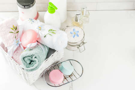 Spa relax and bath concept, sea salt, soap, with cosmetics and towels in bathroom white background, copy spaceの写真素材