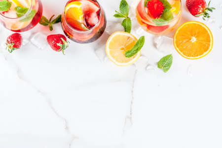 Cold white, pink and red sangria cocktails with fresh fruits, berries and mint.の写真素材