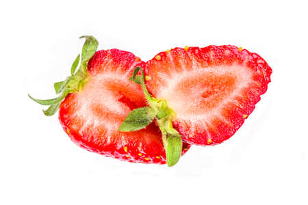 Ripe raw sliced organic strawberry, isolated on white backgroundの写真素材