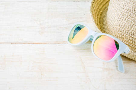 Summer holidays vacation concept background, hat, sunglasses, white wooden background copy space 