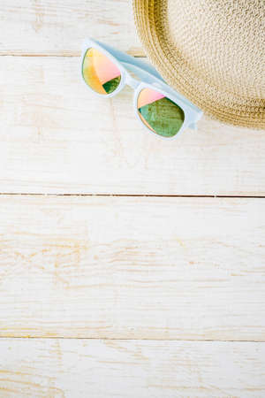Summer holidays vacation concept background, hat, sunglasses, white wooden background copy space の写真素材