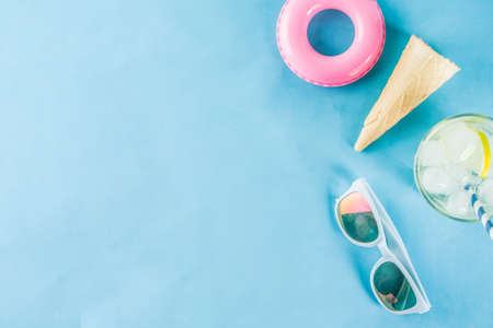 Summer holidays vacation concept background, hat, sunglasses, cooling drink (lemonade, mojito) with...