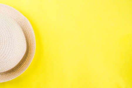 Summer holidays vacation concept background with hat, yellow background copy spaceの写真素材