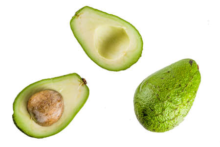 Avocado, halves and whole, isolate on a white background simple pattern