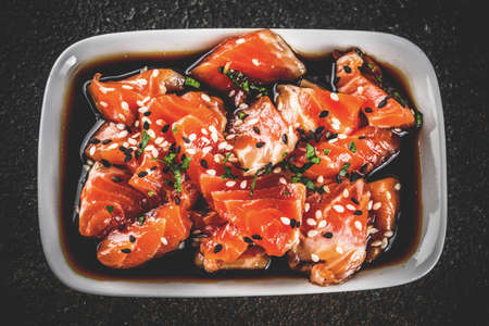 Salmon Sashimi in Marinade (Tamari, Sesame Oil, Lime Juice, and Honey) Topped with Black and White Sesame Seeds  の写真素材