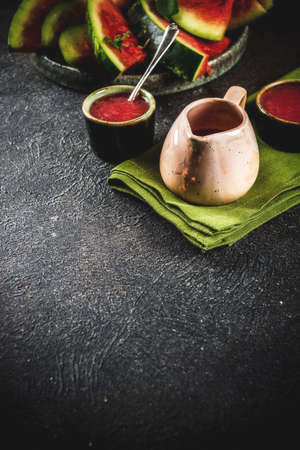 Homemade sweet and sour watermelon sauce, dark rusty background copy spaceの写真素材