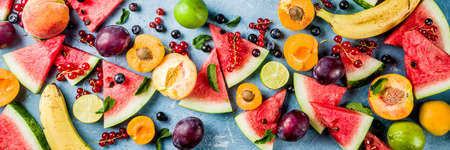 Summer vitamin food concept, various fruit and berries watermelon peach mint plum apricots blueberry...