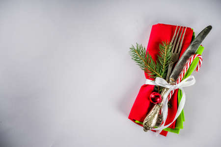 Christmas table setting with fork, knife and xmas decorationsの写真素材