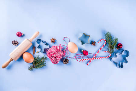 Christmas baking background with  Ingredients for cooking xmas baking, blue background, top view