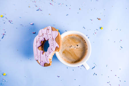 Rest and relaxation concept, coffee cup and biscuits donut with sugar coating, with a notepad for...