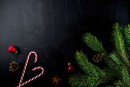 Christmas concept with decorations, fir tree branches, with  calendar December 24, 25, on chalkboard...