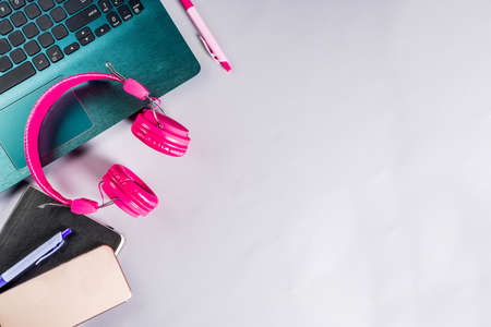 Workplace table with supplies, office concept with notepad, laptop, smartphone, Flat lat light grey background, top view copy space for textの写真素材