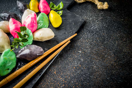 Traditional Chuseok day food, Korean Half-moon Shaped Rice Cake Songpyeon, white marble background copy space top viewの写真素材