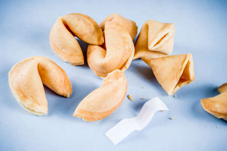 Chinese fortune cookie with prediction on light blue background top view copy spaceの写真素材