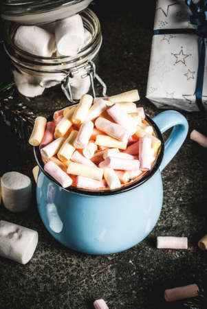 New Year and Christmas drinks idea, hot chocolate mug with marshmallow, dark background, copy spaceの写真素材