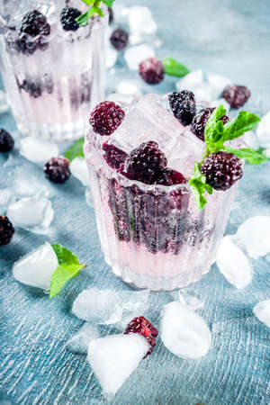 Homemade blackberry lemonade on light blue concrete background copy spaceの写真素材