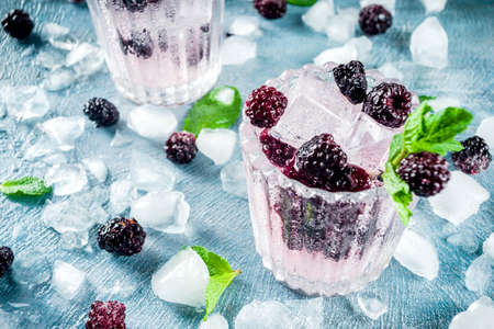 Homemade blackberry lemonade on light blue concrete background copy spaceの写真素材