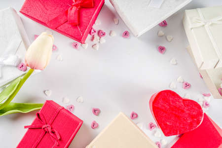 Valentines day gifts boxes background, frame for holiday greeting card background, with confetti ...