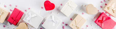 Valentines day gifts boxes background, frame for holiday greeting card background, with confetti ...