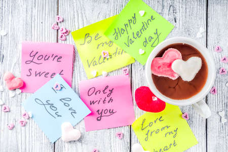 Valentines day concept, stickers with traditional valentine wishes, hot chocolate with marshmallow...