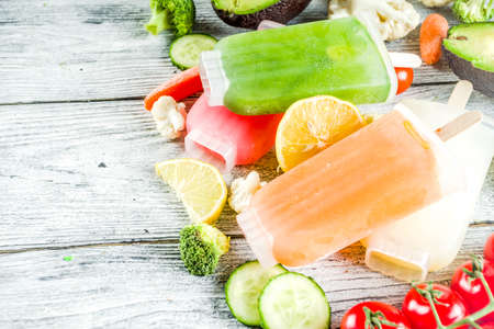 Trendy vegan food, vegetable ice cream , avocado, cucumber, tomato, beet, carrot, broccoli, cauliflower creamy gelato. Dietary healthy lifestyle, summer cold dessert.の写真素材