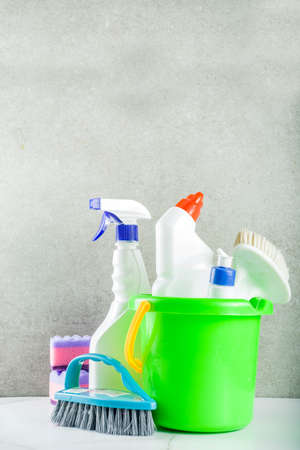 Cleaning concept with different cleaning supplies, on gray stone concrete background copy spaceの写真素材