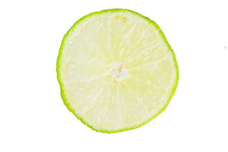 Fresh lime slice with mint leaves isolated on white background, top view copy space. Summer...