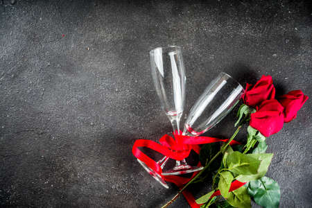 Valentine day concept, Red roses with two champagne glasses, copy space top viewの写真素材