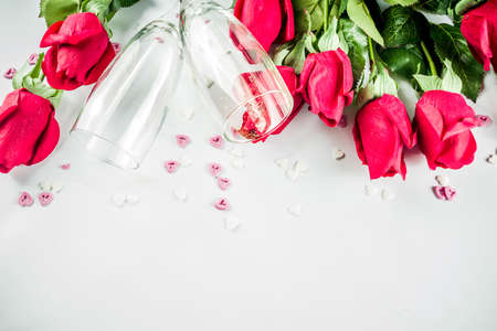 Valentine day concept, Red roses with two champagne glasses, copy space top viewの写真素材