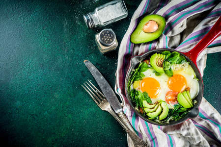 Green vegetable shakshuka. Middle eastern traditional dish shakshouka. Fried eggs with tomatoes,...