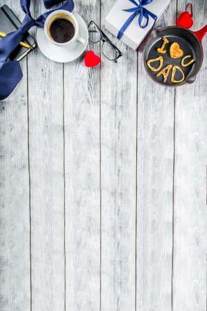 Father's day holiday concept, greeting card background with presents and pancakes letter inscription For best father, I love you dad, wooden background copy space top viewの写真素材