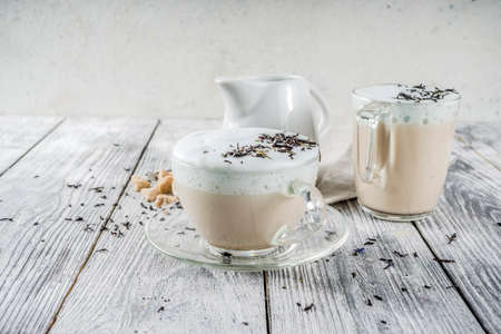 Tea latte, Earl Grey Hot London Fog Tea Drink with Foamed Milk, wooden background copy space