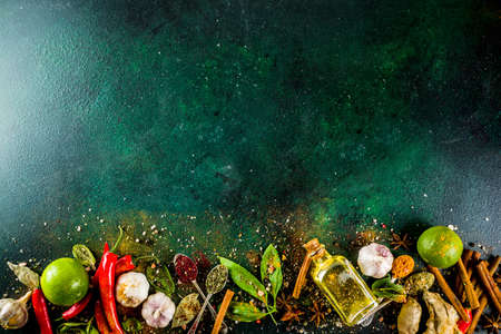 Various herbs and spices on dark background top view copy spaceの写真素材